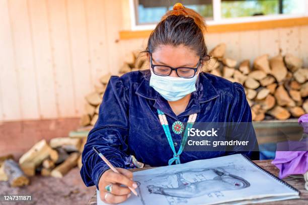 Young Teenage Navajo Girl Drawing A Picture While Wearing A Covi19 Mask Stock Photo - Download Image Now