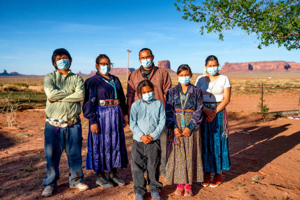 Navajo Family Social Distancing with Covid-19 Masks outside their home in Monument Valley Arizona Navajo Family Social Distancing with Covid-19 Masks outside their home in Monument Valley Arizona navajo nation covid stock pictures, royalty-free photos & images