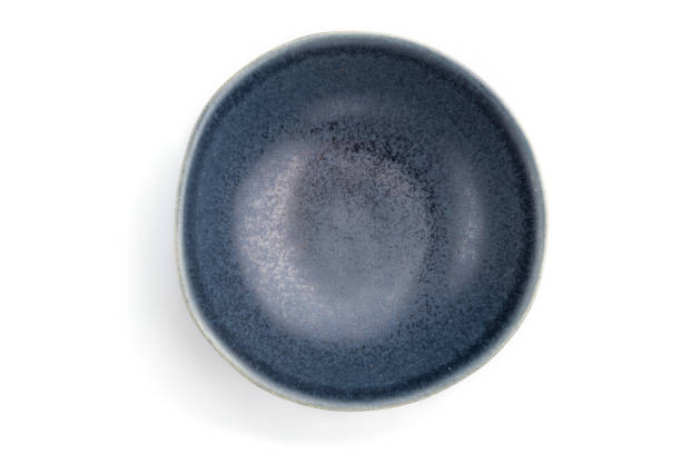 istock Empty blue ceramic bowl isolated on white background. Top view, flat lay, close up. 1247321775