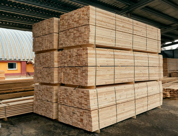 istock Packed boards, lumber piles in the finished goods warehouse 1247337730