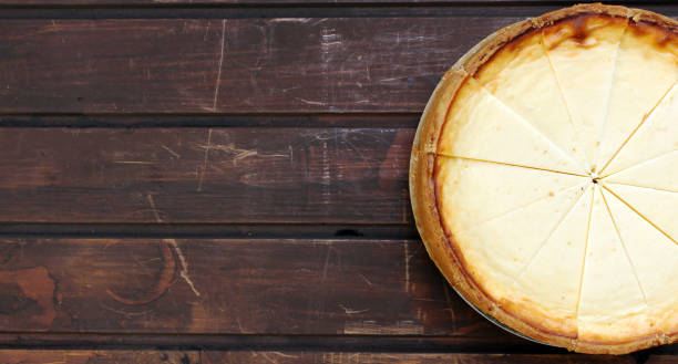 istock Cheesecake on wooden background 1247368580