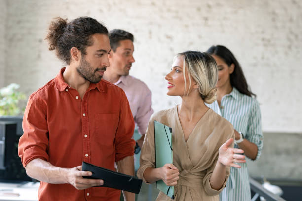 istock Group of People Walking Through the Office Together 1247371864