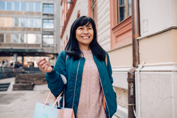 istock Happy Asian enjoying her walk 1247387597