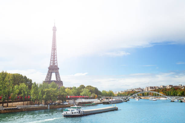 istock Seine river, Eifel tower with boats passing, Paris 1247388661