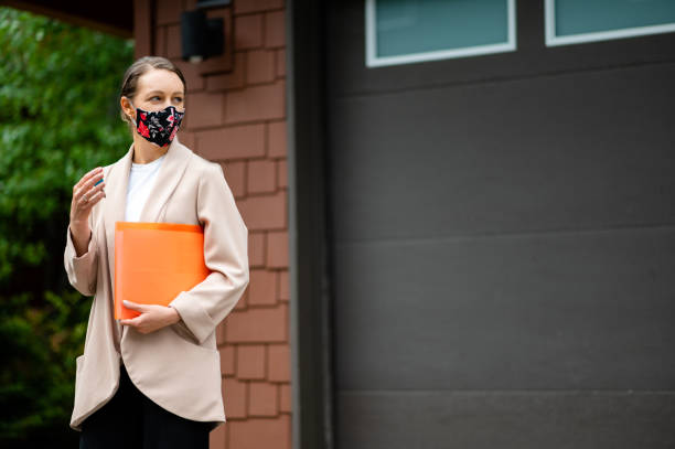 istock Real Estate Agent with a protective face mask 1247388668