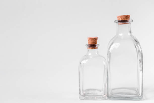 istock Glass bottles with cork on a white background 1247412964
