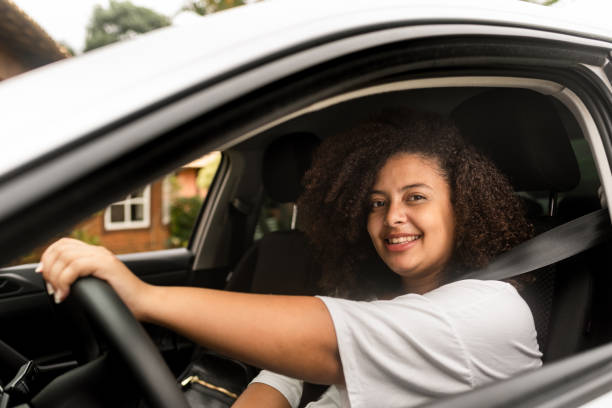 istock Driver woman looking at camera 1247418717