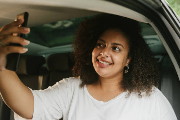 istock Woman taking a selfie inside the car 1247418718
