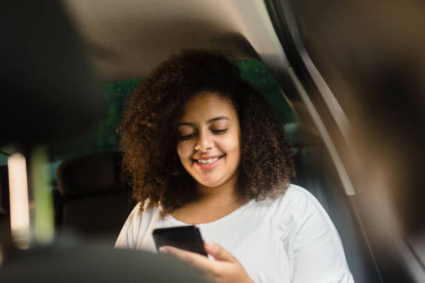 istock Passenger woman using smartphone 1247418720