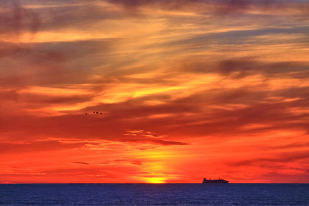 istock Dramatic sunset: navy blue, orange and red colors sunset 1247443035