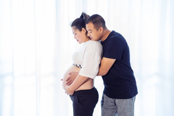 istock Affectionate pregnant couple at home 1247476281