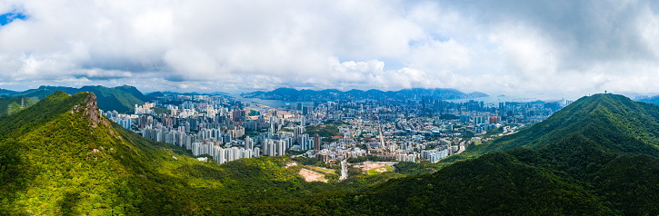 Drone view of Lion rock in hong kong with the city background