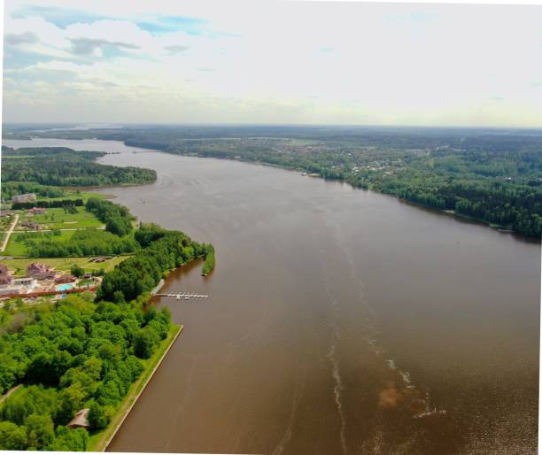 istock Beautiful panoramic landscape from a great height river going beyond the horizon surrounded by green forest in summer with sunny day 1247530477