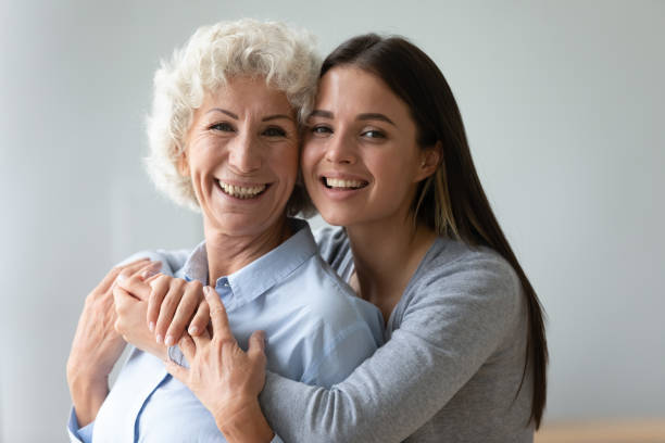 istock Different generations relatives women embracing posing looking at camera 1247568866