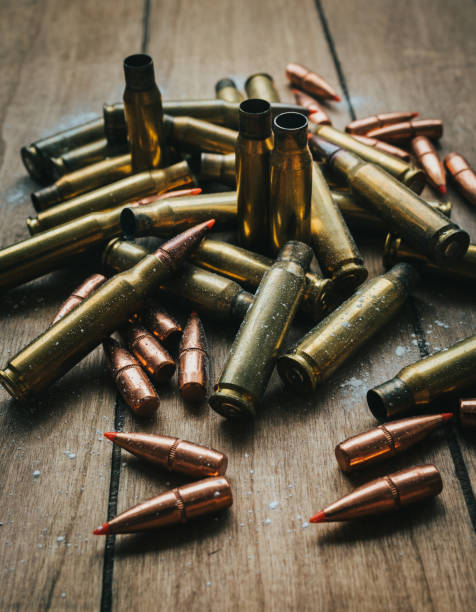 istock .308 Ammunition with projectiles Flat Lay on board surrounded by powder 1247574649