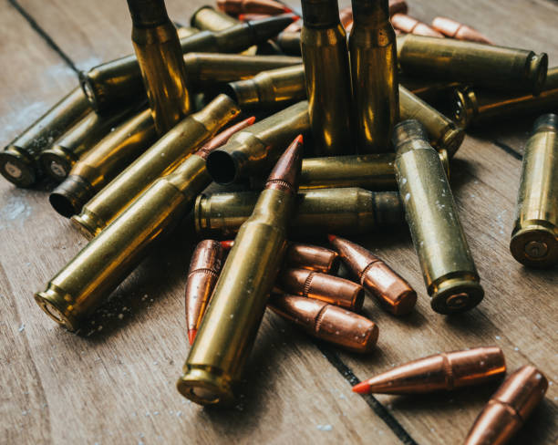istock .308 Ammunition with projectiles Flat Lay on board surrounded by powder 1247575068