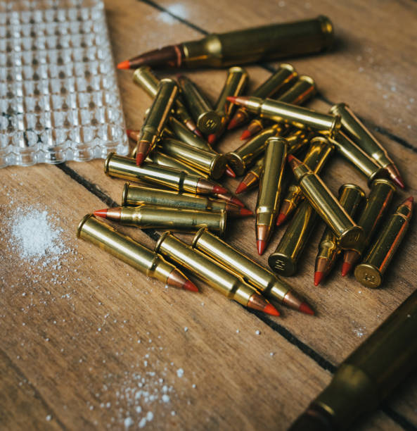 istock 17HMR and .308 Ammunition on board surrounded by powder 1247575077