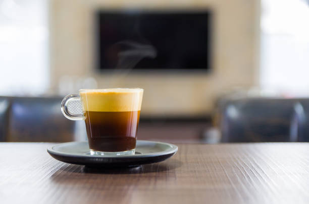 beautiful cup of espresso with cream and foam, capsule coffee. - espresso table coffee cafe imagens e fotografias de stock