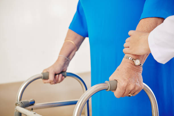 istock Senior woman moving with walker 1247590152