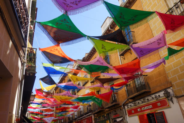 Madrid, Spain - August 17th, 2019: Manila shawls over downtown Madrid during La Paloma Festival, the city's biggest and most important street festival.