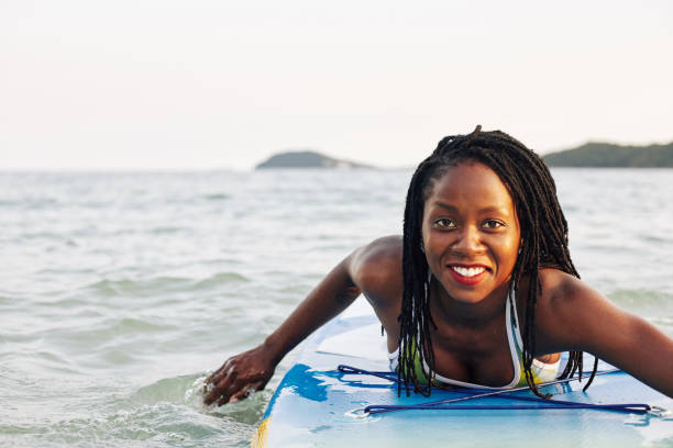istock Woman swimming on supboard 1247604956