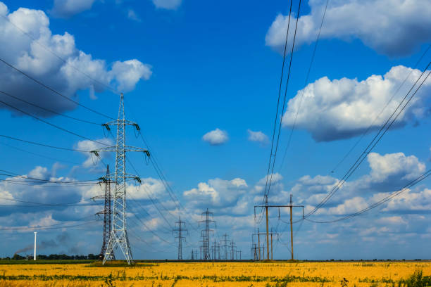 istock elrctric towers among a summer fields 1247638017