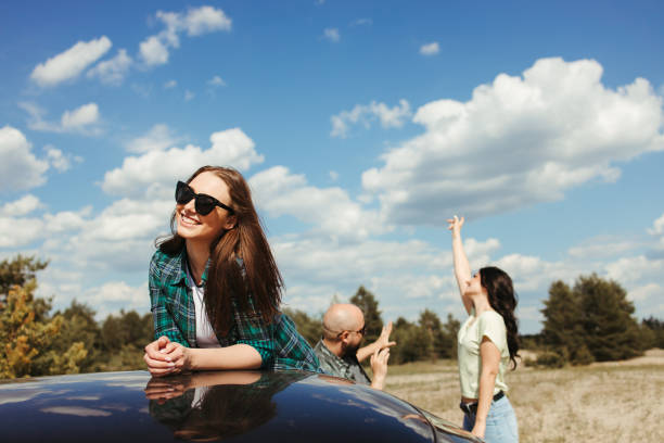 istock Three friends enjoying vacation travel by car 1247643307