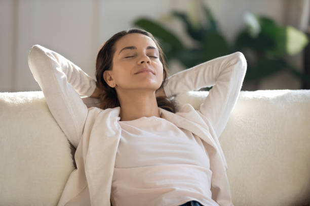 istock Young Caucasian woman relax on couch daydreaming 1247647716