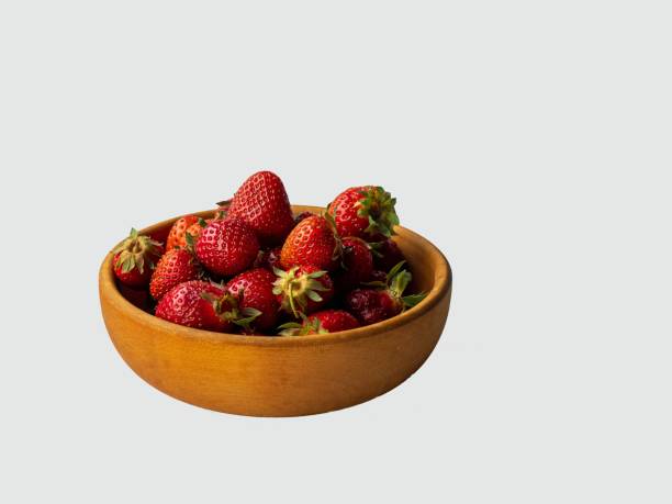 istock ripe strawberries on a wooden plate 1247652617