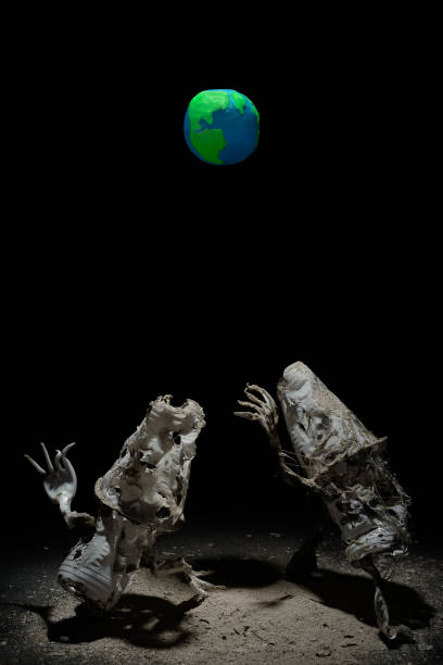istock Plasticine Earth planet handmade above fantasy creatures sculpture from plastic cups, forks and spoons, in selective light. Ecology Concept for Earth Hour, Earth Day, Ocean Day and other ECO dates. 1247652829