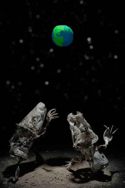 Plasticine Earth planet handmade, above fantasy creatures from plastic on black background with white stars bokeh. Ecology Concept for Earth Hour, Earth Day, Ocean Day and other ECO dates.