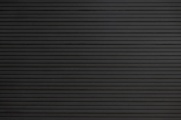black steel wall background and texture. black metal shutter door.