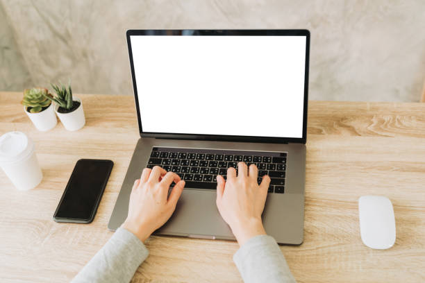 istock woman using laptop and working on wooden table 1247656594