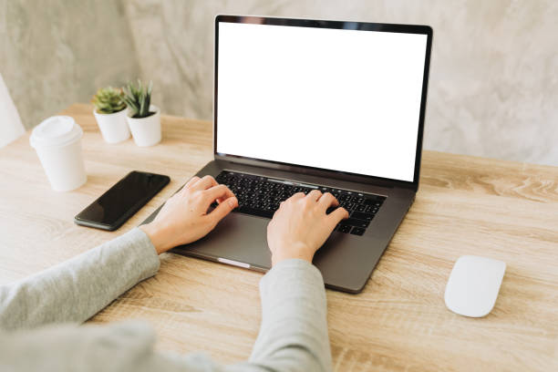 istock woman using laptop and working on wooden table 1247656622