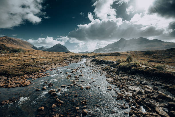 istock Dramatic river scene of the Sligachan mountain range in Scottish Highlands 1247658746