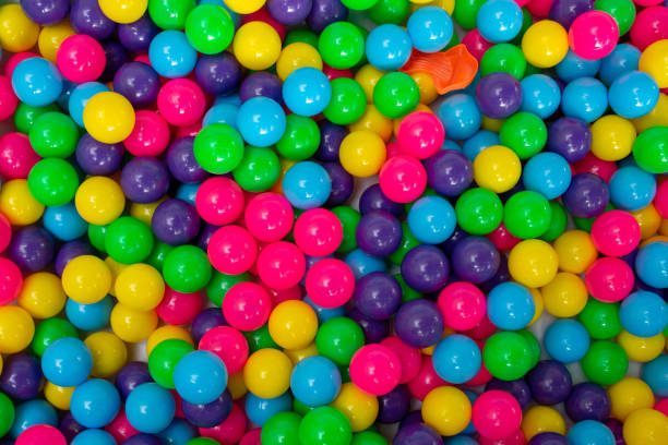 istock Multi color vibrant plastic ball in kids playing station. 1247664726