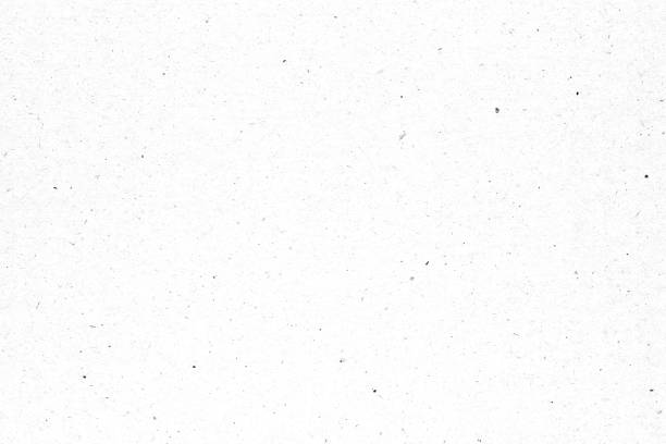 istock White paper or cardboard texture with black spot background. 1247664953