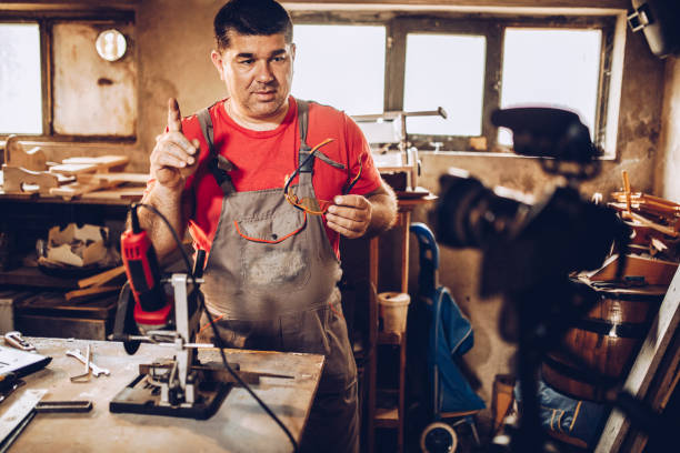 istock Mature male Vlogging in his workshop 1247665474
