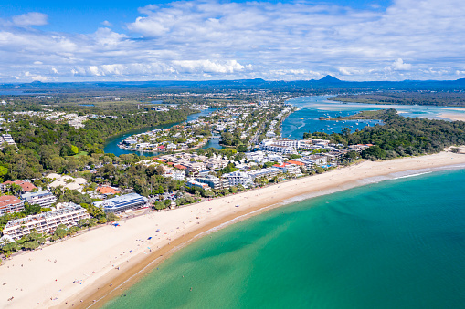 Noosa Heads is a popular Sunshine Coast tourist destination with sunny weather and a beautiful beach.