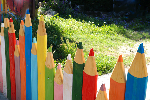 fence in the park like colored pencils close-up