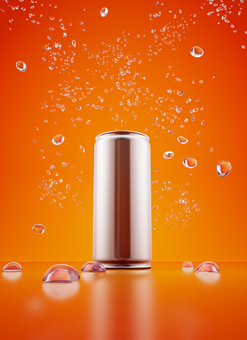 Metallic can, orange energy drink and splash of water