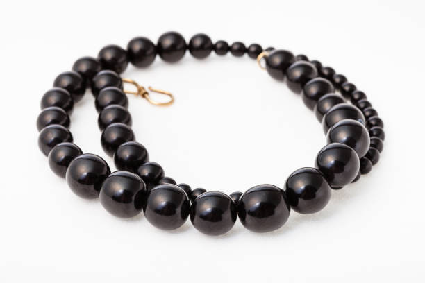 istock coiled necklace from polised jet stone on white 1247675170
