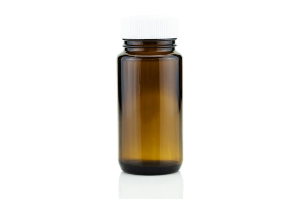 istock Blank brown glass pill bottle isolated on white background with clipping path 1247678346