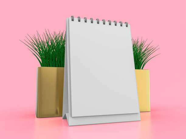 istock Desk blank calendar mockup on pink background. 3D illustration 1247682192