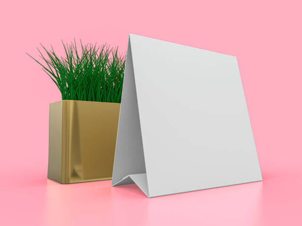 istock Blank paper Table Tent. Mockup on pink background. 3D illustration. 1247682231
