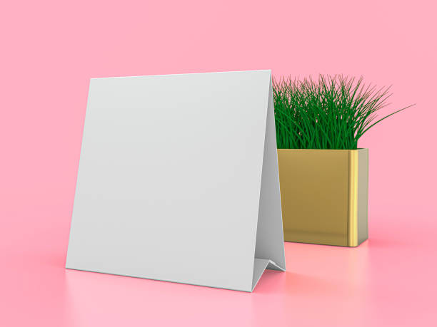istock Blank paper Table Tent. Mockup on pink background. 3D illustration. 1247682232