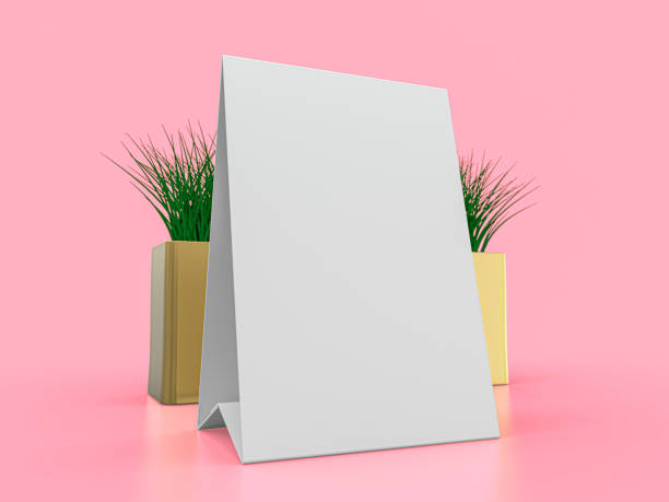 istock Blank paper Table Tent. Mockup on pink background. 3D illustration. 1247682234