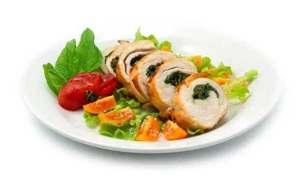 Spinach Stuffed Chicken Breast Healthyfood or Maincorse dish decorate tomato and vegetables sideview