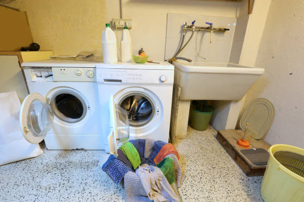 istock interior of a laundry area with two washing machines and clothes 1247686932