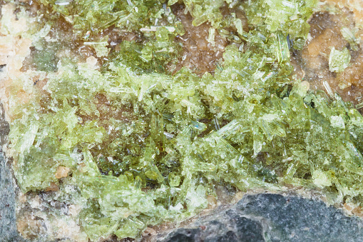 Macro mineral stone Emeralds on a white background close up